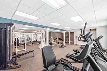 a gym with a lot of exercise equipment